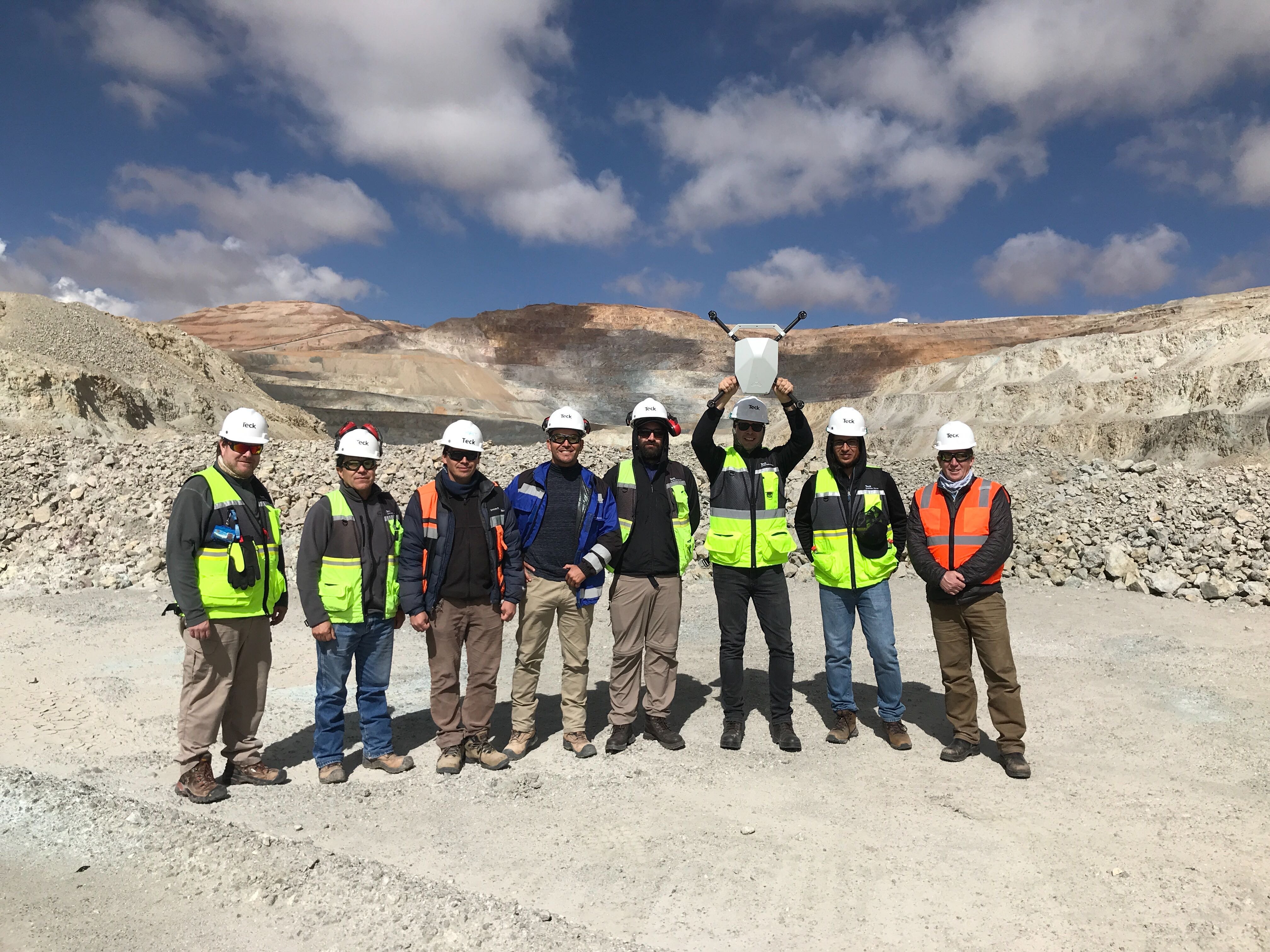 Mine surveyors and geotechnical engineers using drones in their open pit mine