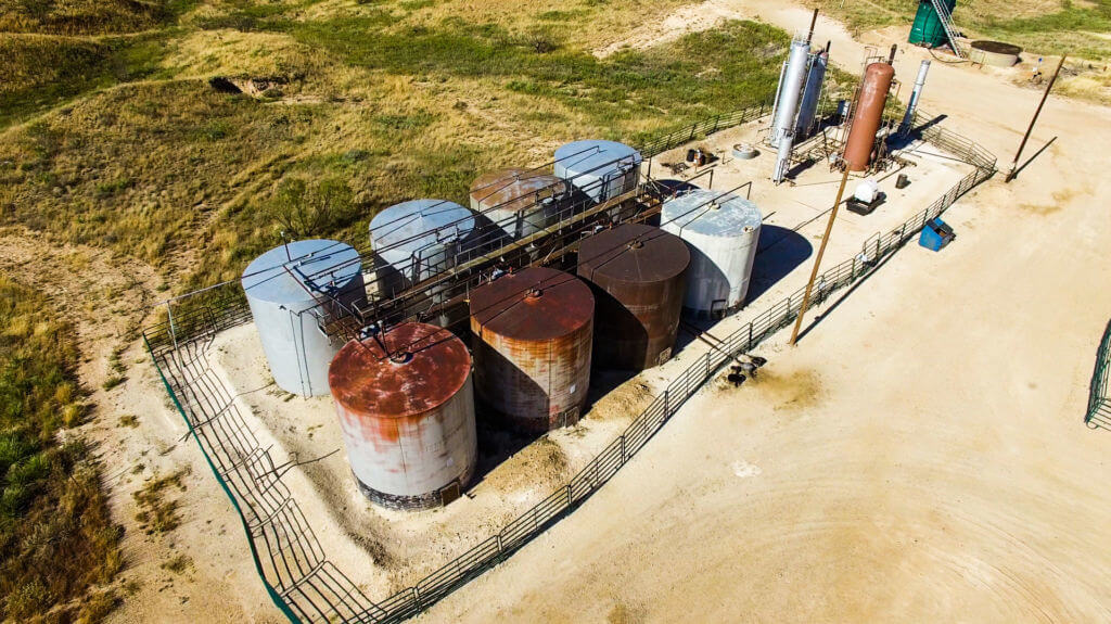 Rusted oil tanks in need of inspection.