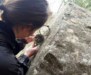 geologist walks up to a highwall to take measurements the traditional way